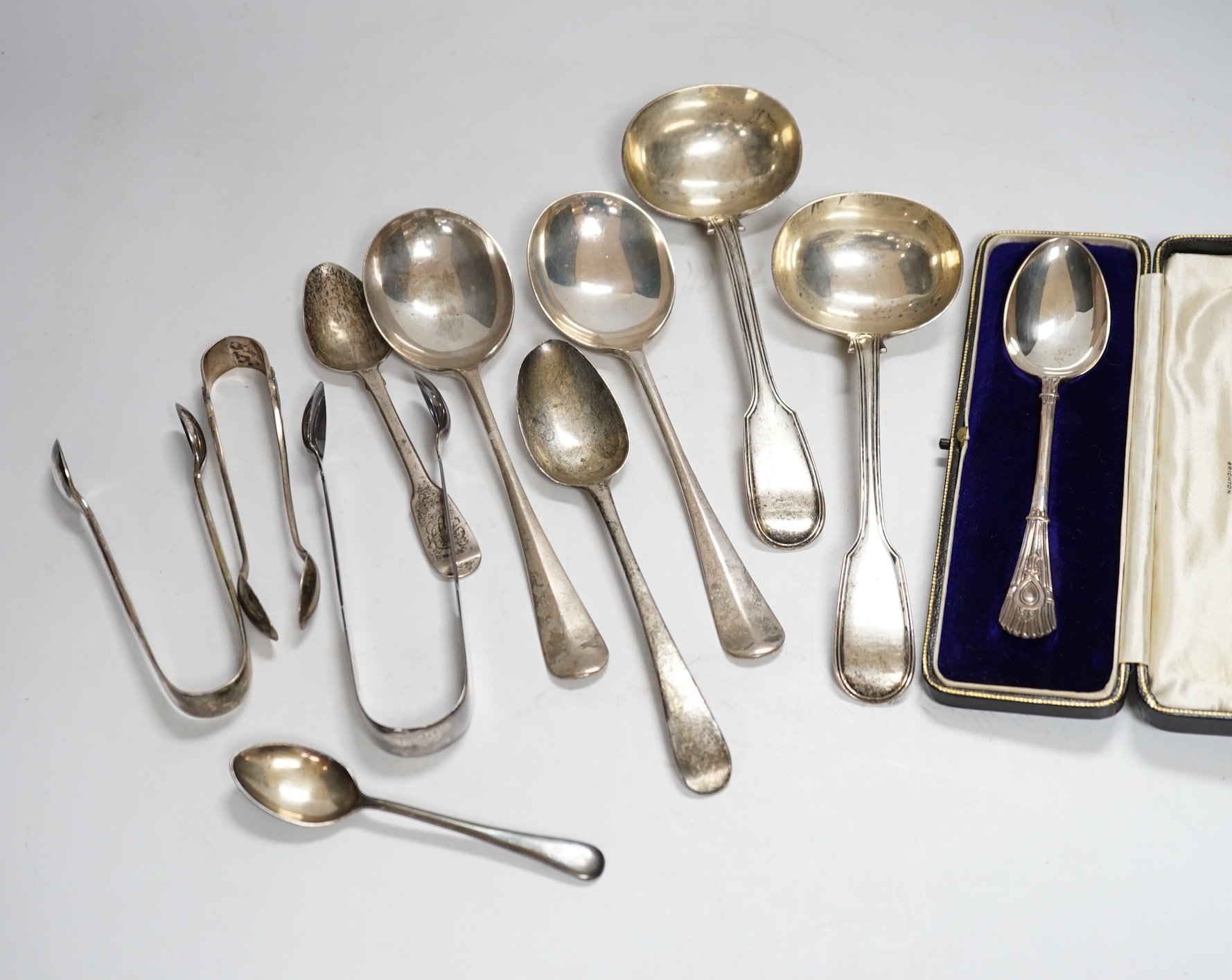 A small group of assorted silver flatware, including pair of fiddle and thread pattern sauce ladles, Elizabeth Eaton, London, 1848